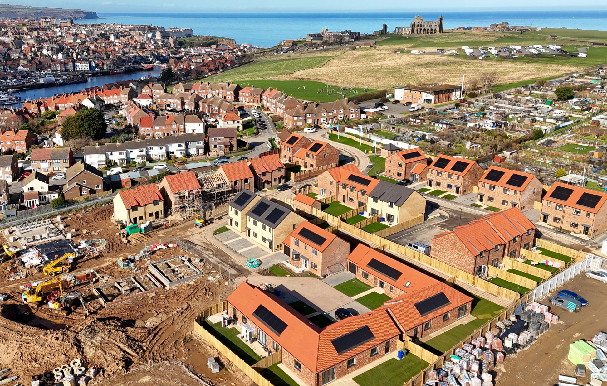 Housing development under construction with solar panels