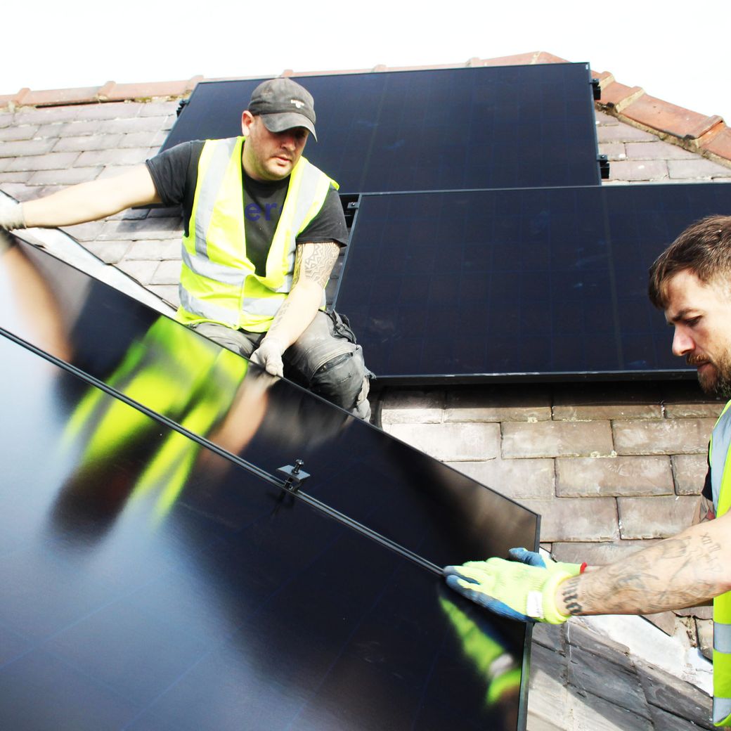 solar panels being installed on house